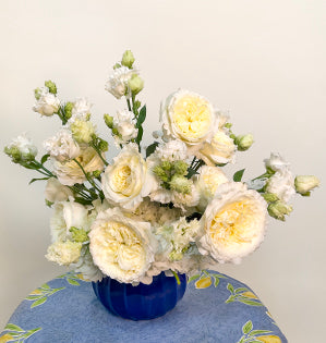 A simple pitcher design created with hydrangea, Patience garden roses, and lisianthus.