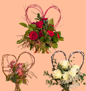 Charming bouquets for Valentine's featuring a variety of garden roses, foliage, and filler flowers, all paired with armature style hearts made from curly willow, red twig dogwood, and pussy willow.